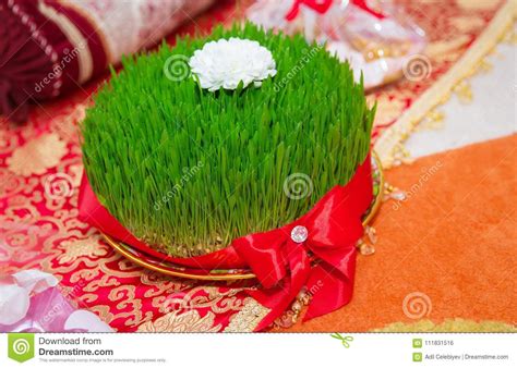 A Seminal Floor On A Red Ribbon On A Dry Grass Novruz National