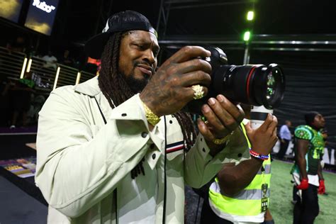 Former NFL Star Marshawn Lynch Is Dragged Out Of His Car During DUI Arrest New Footage Shows