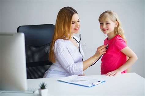 Pediatrician Doctor Examining Little Girl Stock Photo Image Of