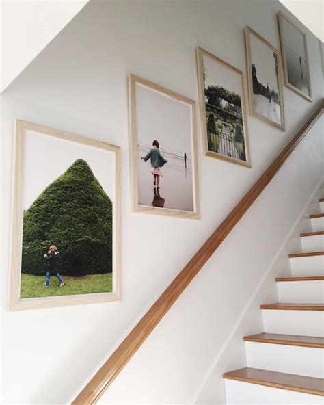 Highlight natural wood stairs by contrasting the ends with modern, white paint. 16 Best Staircase Wall Decor Ideas to Make Your Hallway ...