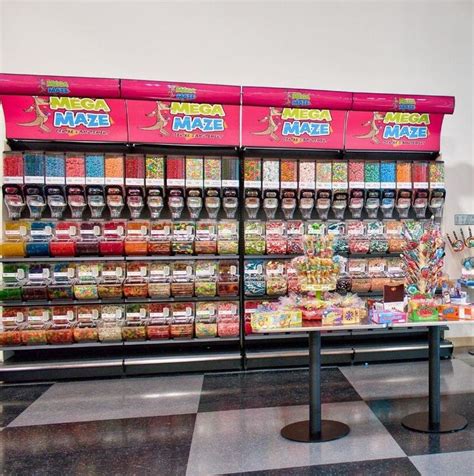 A Display Case In A Store Filled With Lots Of Food And Confection Items
