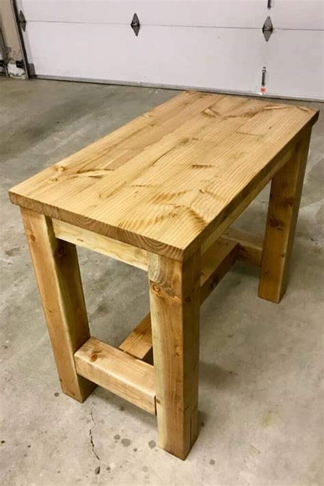 Turn your table onto its side and place the pvc pieces over each foot, then stand it up carefully. How To Build A Counter Height Table - Sunshine And Rainy Days