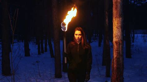 A Beautiful Woman With Torch Walking To A Camera In Winter Forest Stock Video Footage Storyblocks