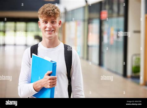 Portrait Of Male Student Standing In College Building Stock Photo Alamy