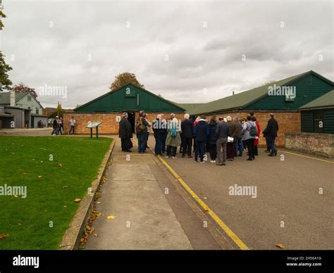 Visitors Listening To A Guide In Bletchley Park With Some Of Code