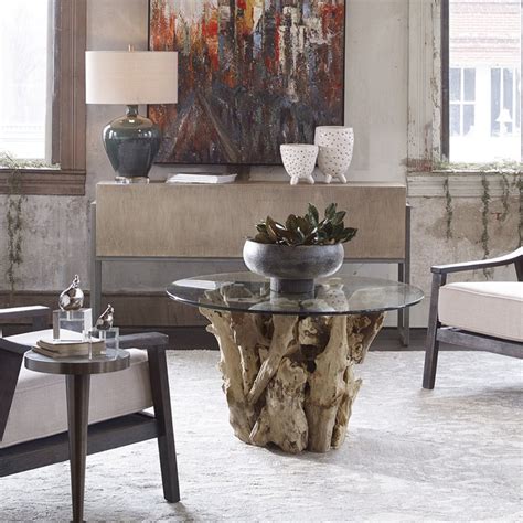 Its transparent top surface allows the beauty of your flooring to show through. Uttermost Driftwood Glass Coffee Table in Natural - 25519