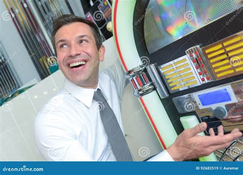 Young Man Playing Slot Machine Stock Image Image Of Nightlife