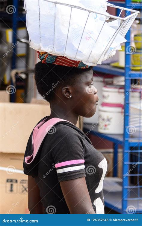 unidentified unidentified ghanaian woman carries a basket with editorial photo image of