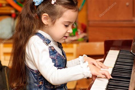 Girl Plays Piano — Stock Photo © Bestphotostudio 1617867