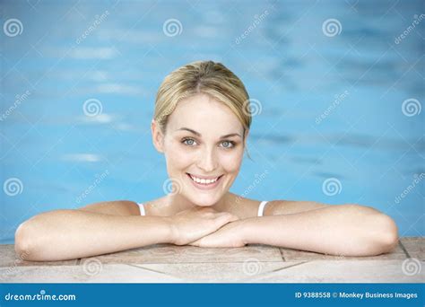 Young Woman Resting On Edge Of Swimming Pool Stock Photo Image Of