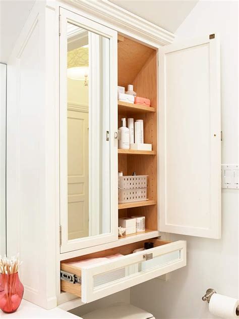 Additionally an open shelf provides space to display all of your bathroom accessories. Mirrored Doors - Transitional - bathroom - BHG