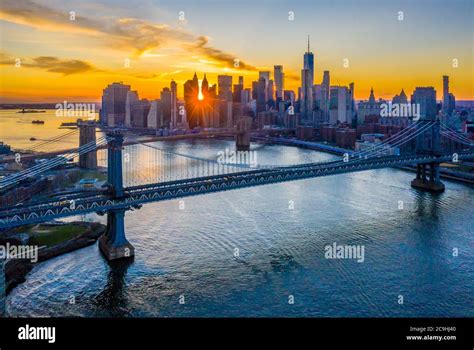 Aerial View Of The Brooklyn And Manhattan Bridges At Sunset With The