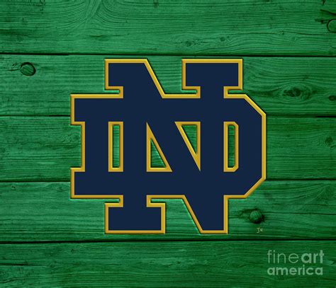 University Of Notre Dame Fighting Irish Logo On Green Rustic Boards
