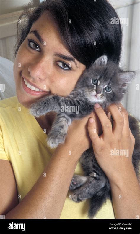 Teenage Girl Holding Tabby Grey Kitten Stock Photo Alamy