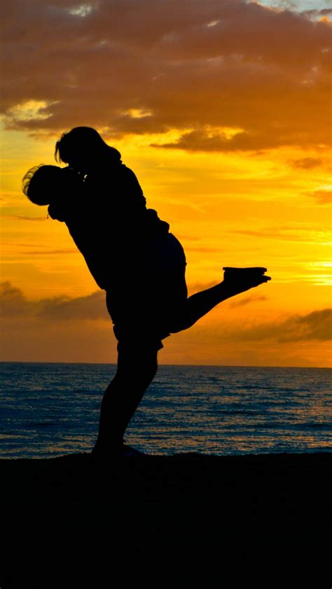 couple romantic kiss sea sunset silhouette 4k ultra hd mobile wallpaper