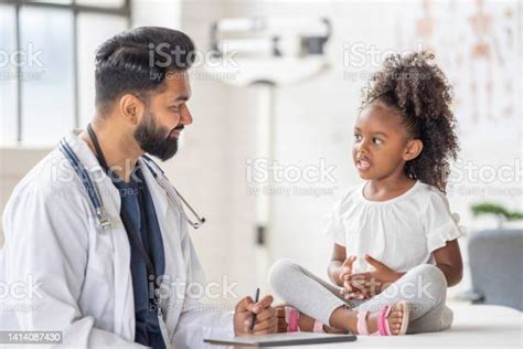 Doctor Seeing A Young Patient Stock Photo Download Image Now 25 29