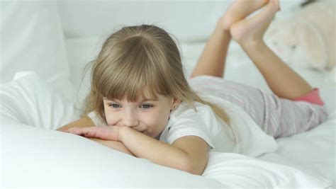 You may easily purchase this image i2097158 as guest without . Girl Lying Down Stock Footage Video | Shutterstock