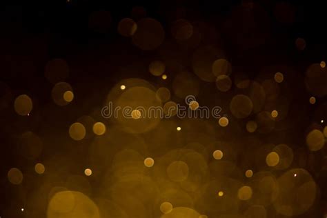 Abstract Gold Bokeh With Black Background Stock Photo