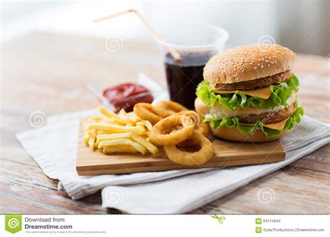 Close Up Of Fast Food Snacks And Drink On Table Stock Photo Image Of