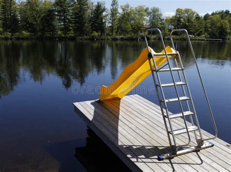 Water Slide On The Lake Stock Image Image Of Dock Yellow 14376573