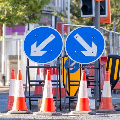 Two Blue And White Circular Road Signs With Arrows Stock Image Image