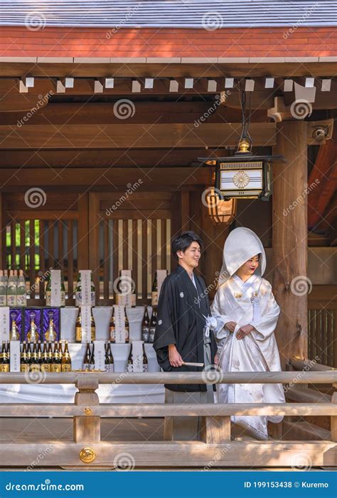 Japanese Shinto Wedding Of A Couple In Kimono Under A Lantern Of The