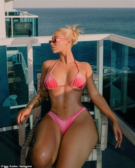 Iggy Azalea Flashes Her Underboob In A Tiny Pink Bikini As She Poses Up A Storm During Mystery