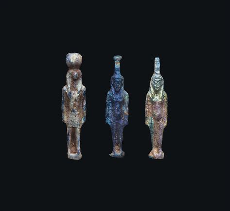 Three Egyptian Iridescent Blue Glass Striding Deity Amulets Ptolemaic Period Circa 3rd 1st