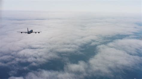 4k Stock Footage Aerial Video Reveal A Learjet C 21 Flying Over Hills Toward A Lake In Northern