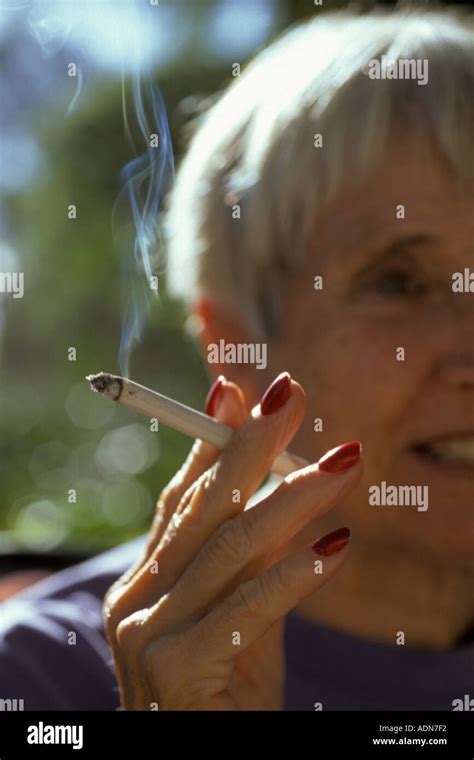 Mature Woman Smoking Cigarette Stock Photo Alamy