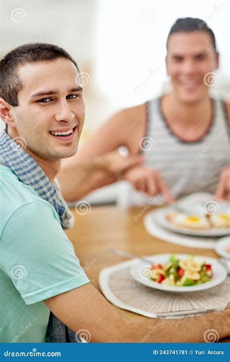 couple who eat together stay together portrait of a gay couple having lunch together stock