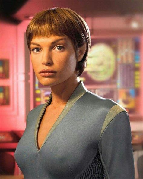 a star trek enterprise character standing in front of a computer screen with the caption star