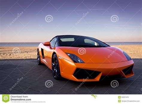 Find images of orange car. Luxurious Orange Sports Car Near Beach Stock Photo - Image ...