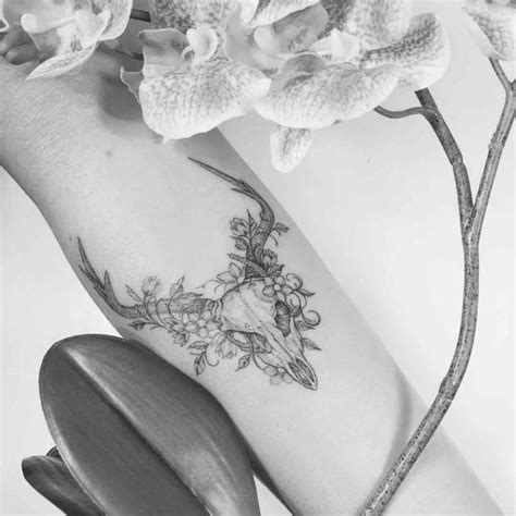 This versatile item will drape a colony of bats and skulls anywhere your heart desires. Flower Tattoo Design #uniqueflowertattoo | Feminine skull ...