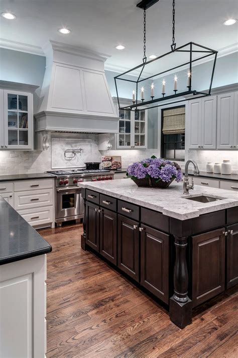 The dark hardwood flooring contrasts with the canary yellows in the lights wood floors enhance the natural beauty of the kitchen. 38 Immaculate Kitchens with Dark Floors (Photo Gallery ...