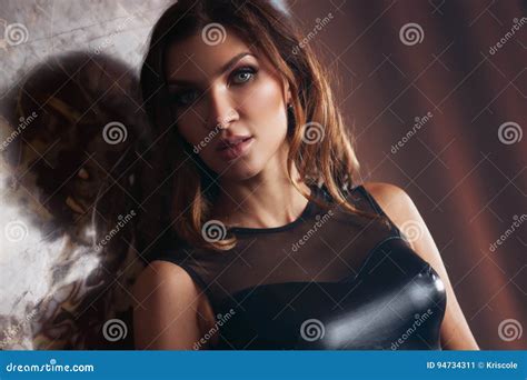 Young Brunette In A Leather Jacket A Beautiful And Slim Figure Indoors Stock Image Image Of