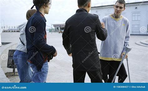 Skill Young Man With One Leg On Crutches Training And Three Of His