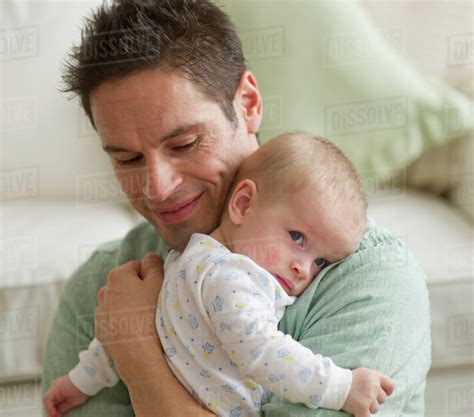 Father Hugging Baby Stock Photo Dissolve