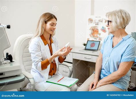 Senior Patient With Ophthalmologist In The Office Stock Photo Image
