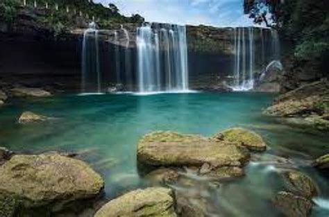 Kune Falls Is Popular At These Dramatic Tiered Waterfalls