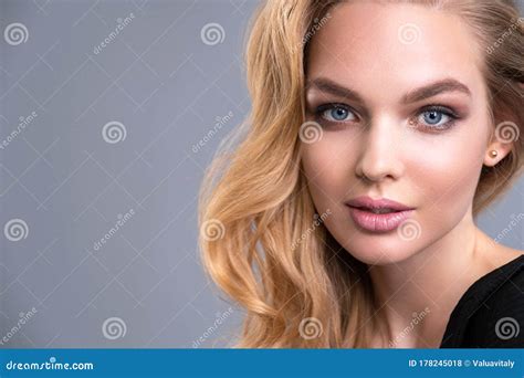 Beautiful Face Of An Attractive Model With Blue Eyes Woman With Beauty Long Brown Hair And