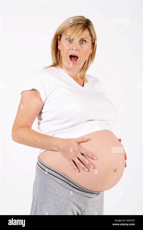 Attractive Healthy Young Pregnant Woman Attractive Healthy Young Pregnant Woman Looking At Her