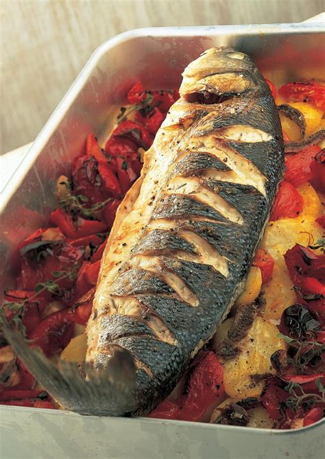 Baked Sea Bass With Roasted Red Peppers Tomatoes Anchovies And Potatoes The Happy Foodie
