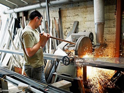 Sheet Metal Worker Cutting Metal Bar In Metal Shop High Res Stock Photo