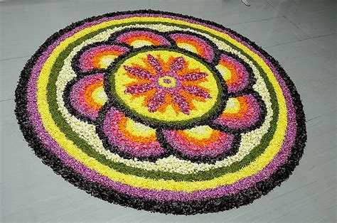 The woman is pretty detailed, accessorized with floral necklace. Worlds Largest collection of Pookalams (Flower Carpet ...