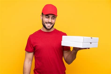 premium photo pizza delivery man with red cap and tshirt