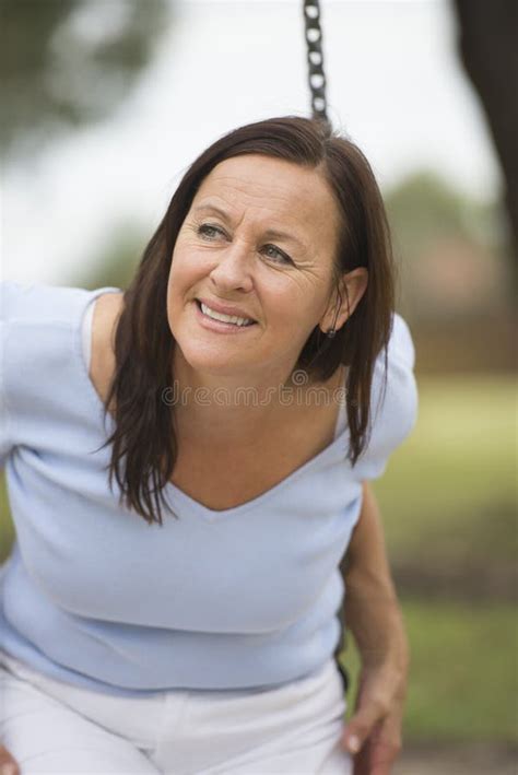 Relaxed Smiling Mature Woman Outdoor Stock Image Image Of Blurred