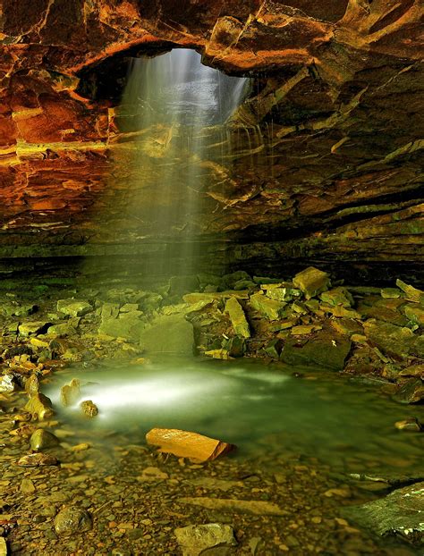 A Waterfall Shines Through The Top Of A Cave In Arkansas Near Eureka