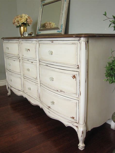 Richly detailed, ornamental wood furniture is often the cornerstone of the french country home, usually accented with rich textiles and lots of small decorative details. Antiqued French Dresser