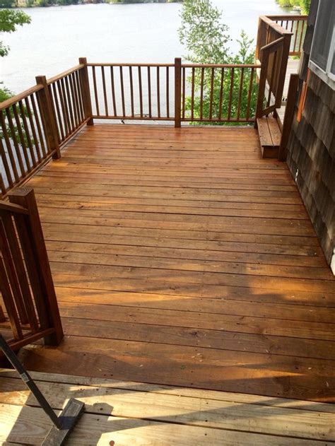 People choose deck stain colors on the basis of their preferences and setting around it. Final coat of Olympic cedar Naturaltone on the side deck ...
